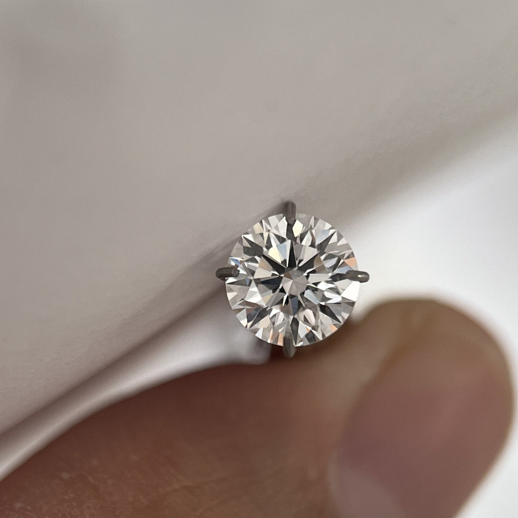 Round moissanite side profile showing crown and pavilion - Caratura