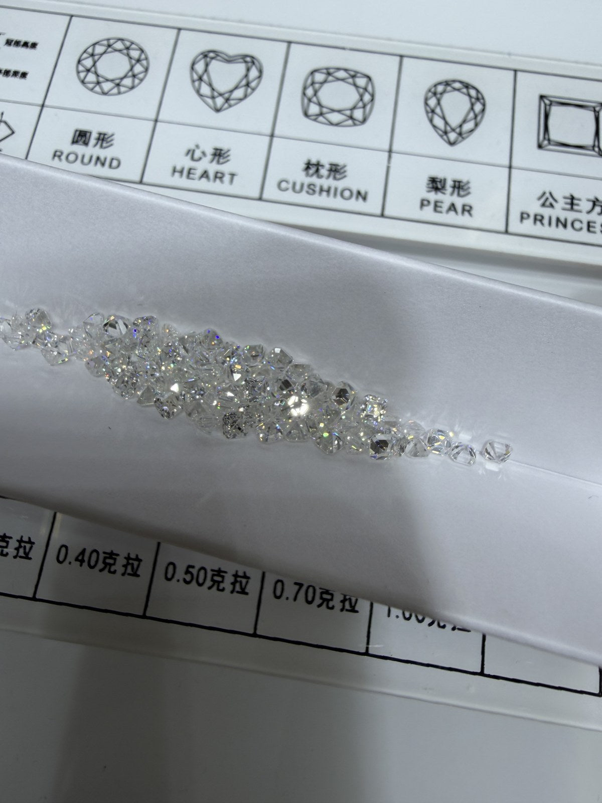 Asscher lab-grown diamond melee, DE VS-VVS, on an inspection tray