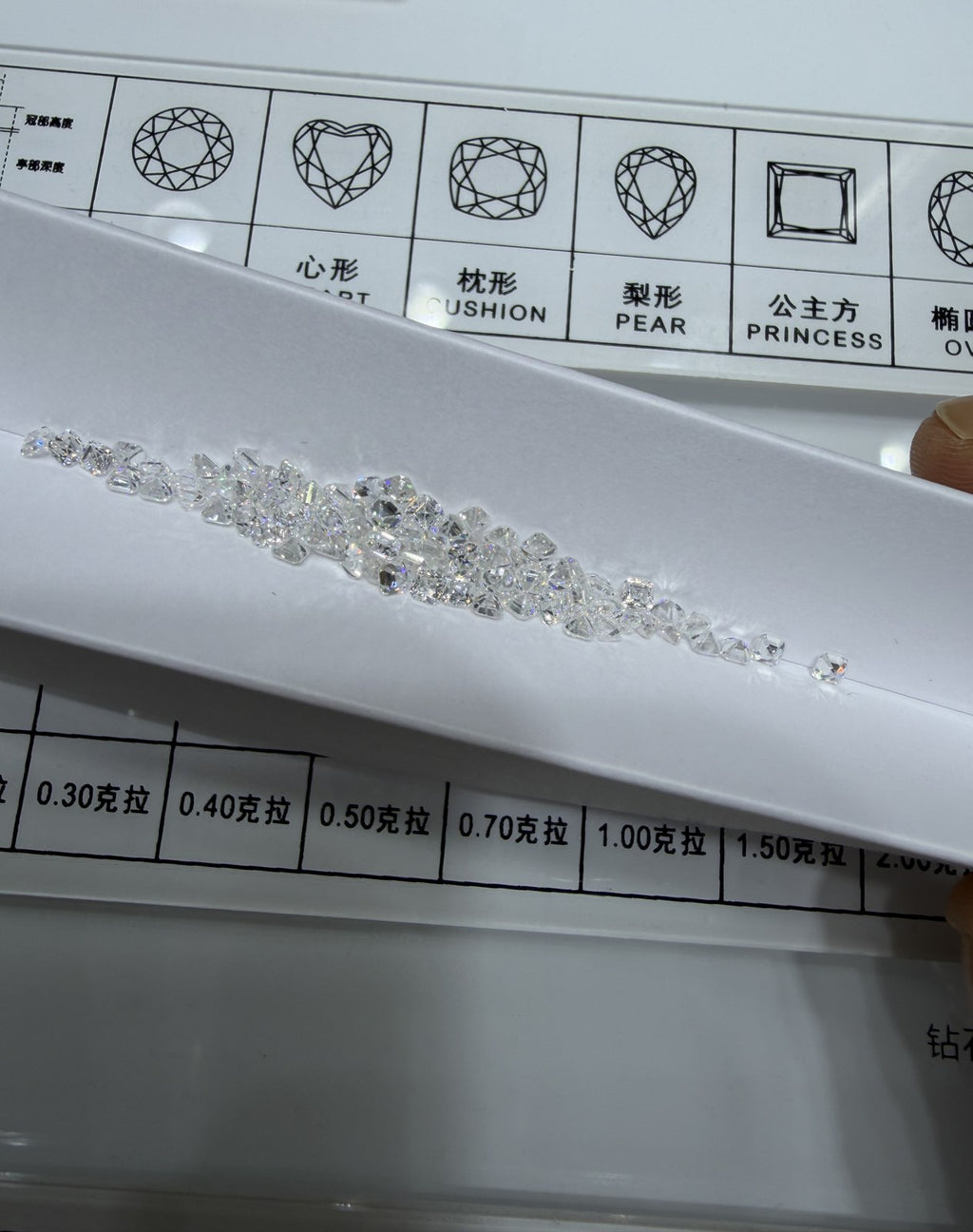 Asscher lab-grown diamond melee, DE VS-VVS, on an inspection tray