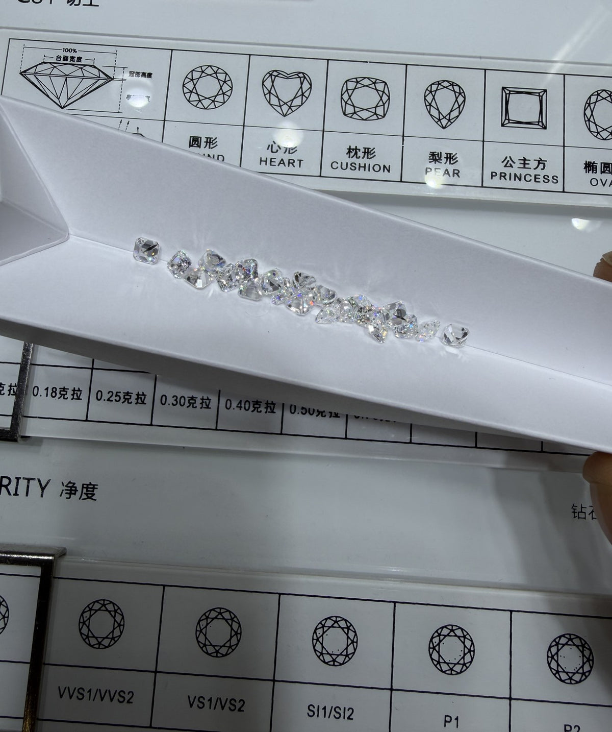 Asscher lab-grown diamond melee, DE VS-VVS, on an inspection tray