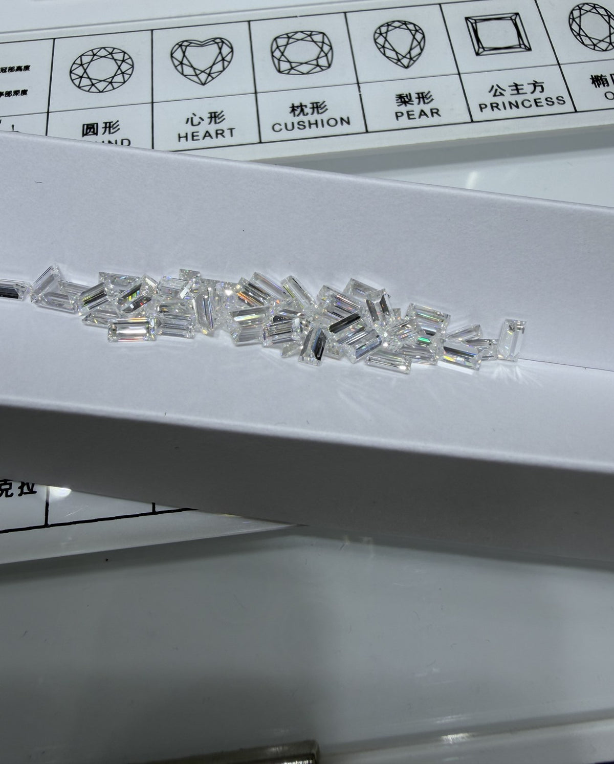 Baguette lab-grown diamond melee, DE VS-VVS, on an inspection tray