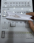 Cushion lab-grown diamond melee, DE VS-VVS, on an inspection tray