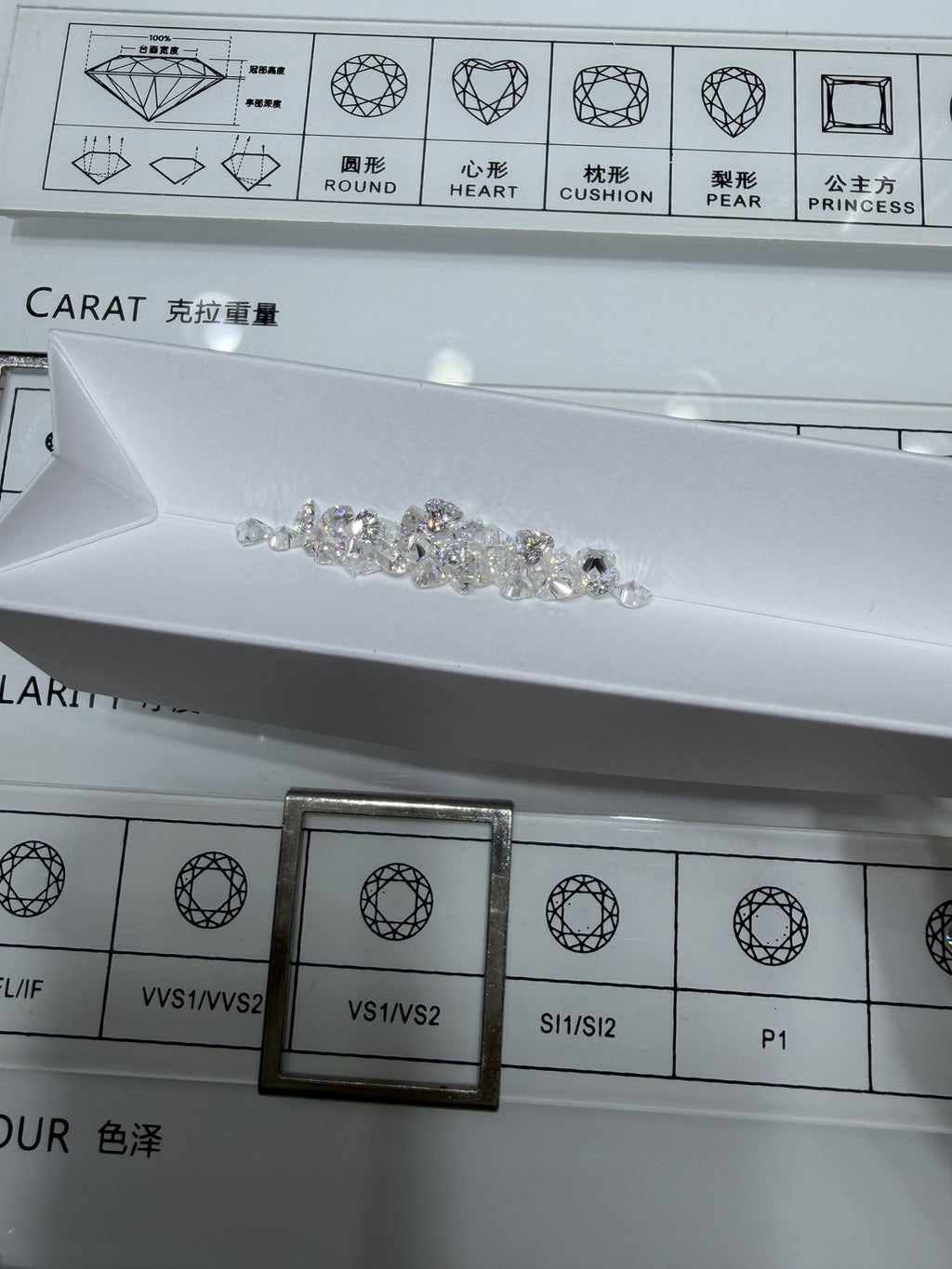 Heart lab-grown diamond melee, DE VS-VVS, on an inspection tray