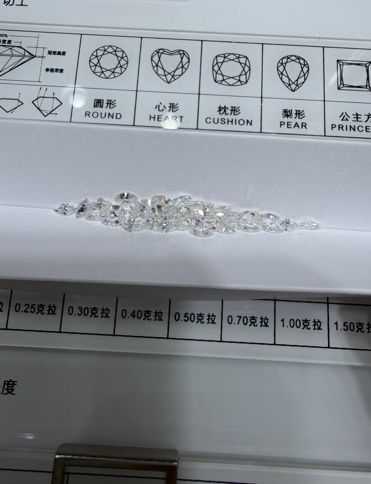 Marquise lab-grown diamond melee, DE VS-VVS, on an inspection tray