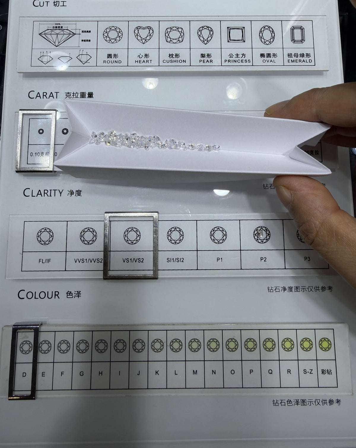 Pear lab-grown diamond melee, DE VS-VVS, on an inspection tray