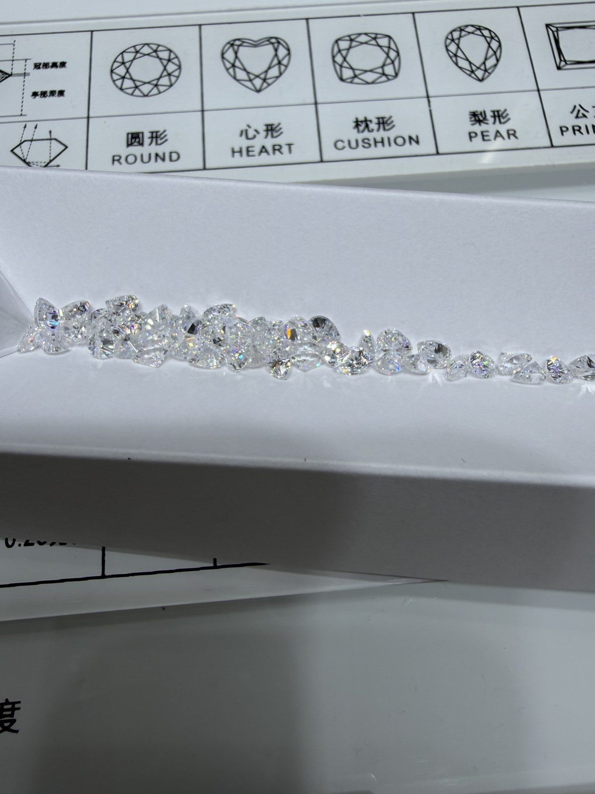 Pear lab-grown diamond melee, DE VS-VVS, on an inspection tray