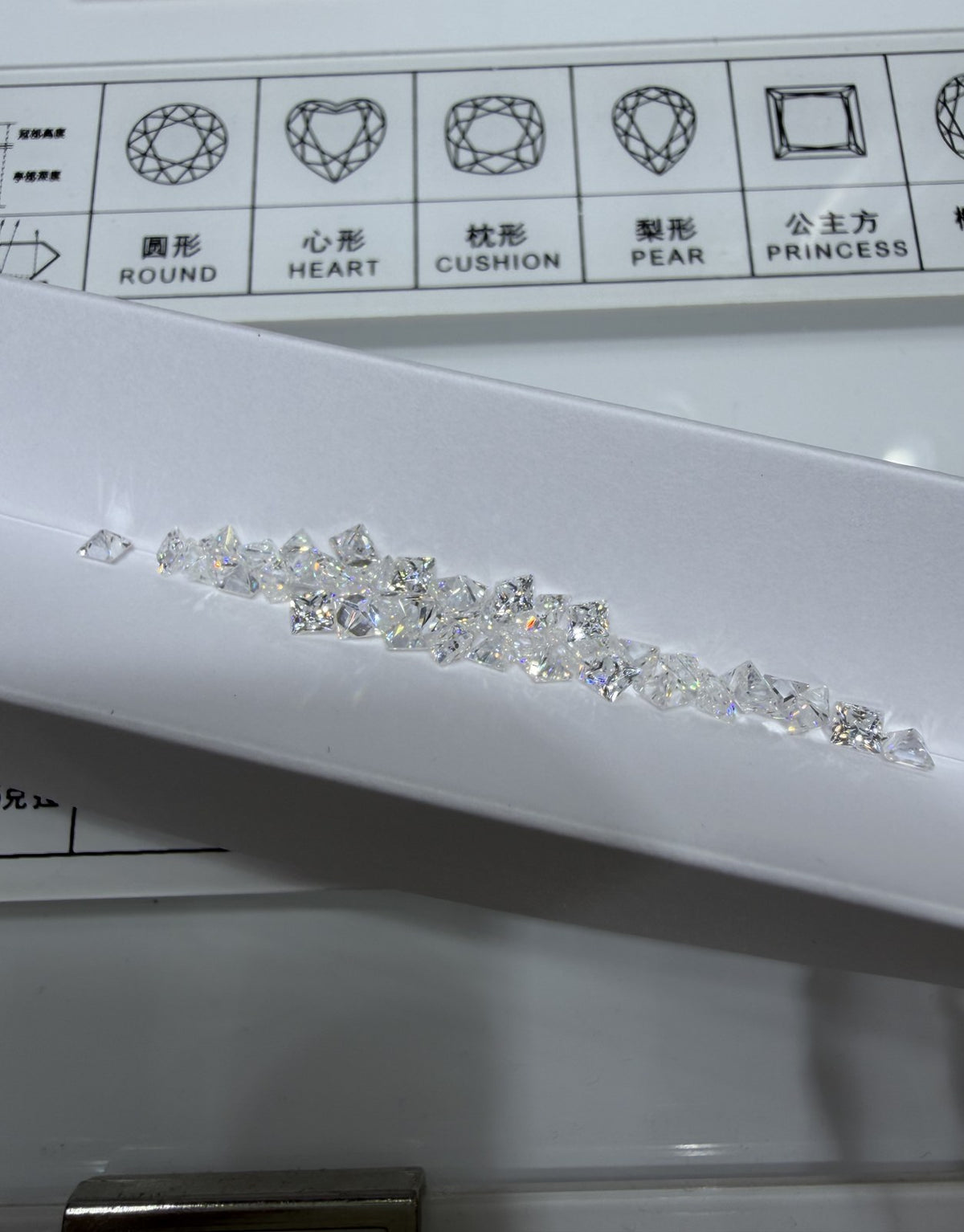 Princess lab-grown diamond melee, DE VS-VVS, on an inspection tray