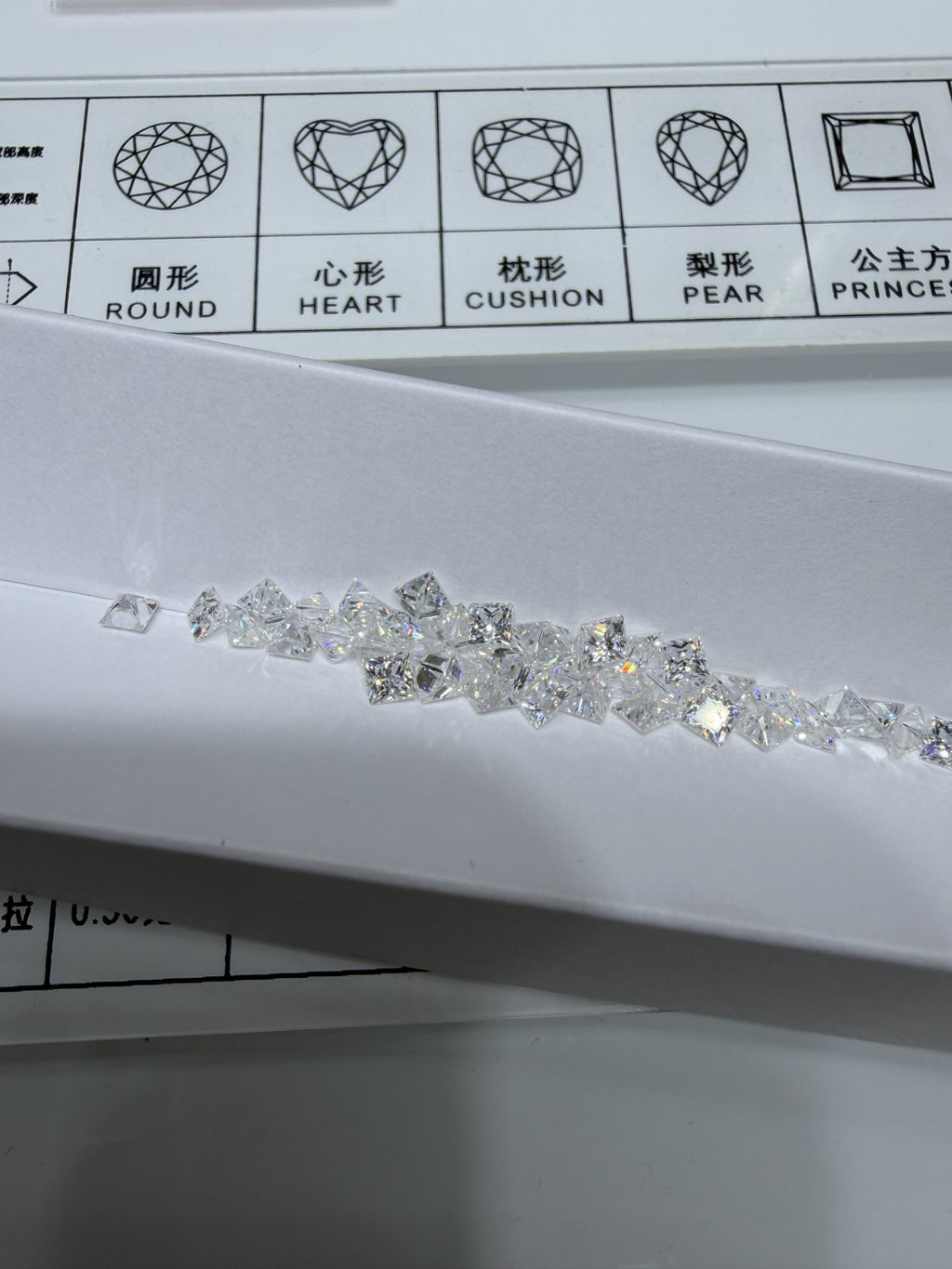Princess lab-grown diamond melee, DE VS-VVS, on an inspection tray