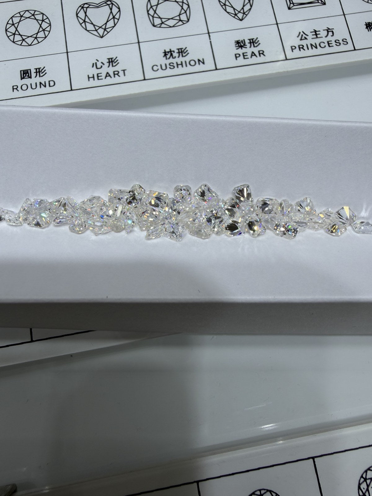 Radiant lab-grown diamond melee, DE VS-VVS, on an inspection tray